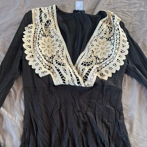 Black venus blouse, low cut v neck with embellished lace